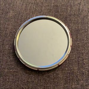 Pocket mirror.